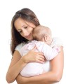 loving mother hugging her baby isolated on white background